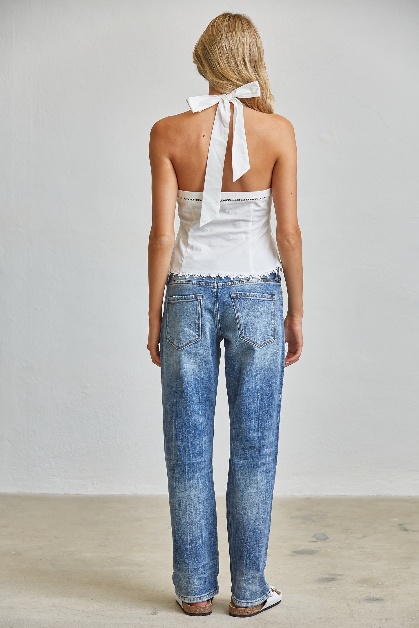 TIE ACCENT CHARM HALTER PEPLUM TOP