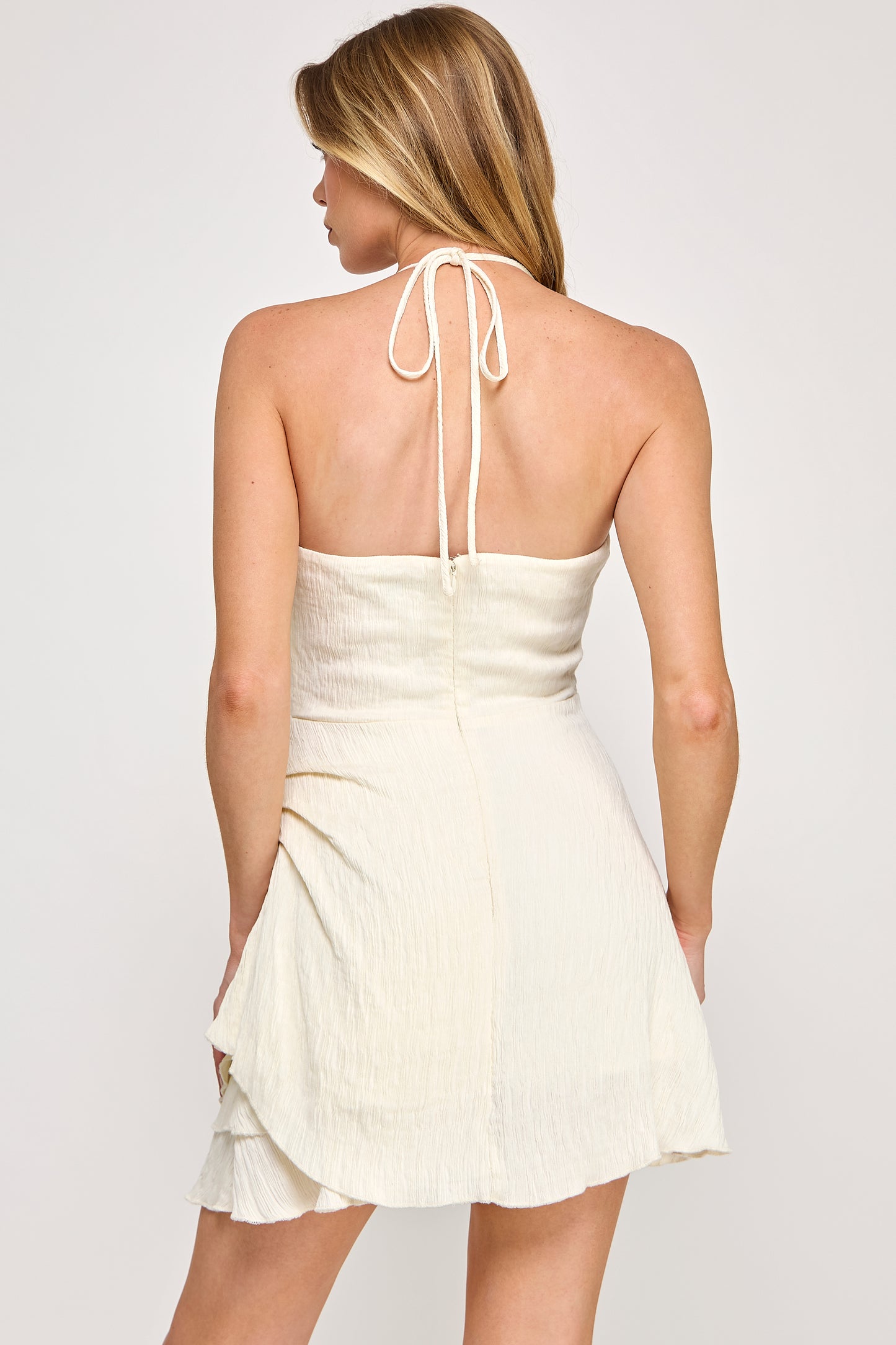 TEXTURED HALTER MINI DRESS WITH RUFFLE DETAIL