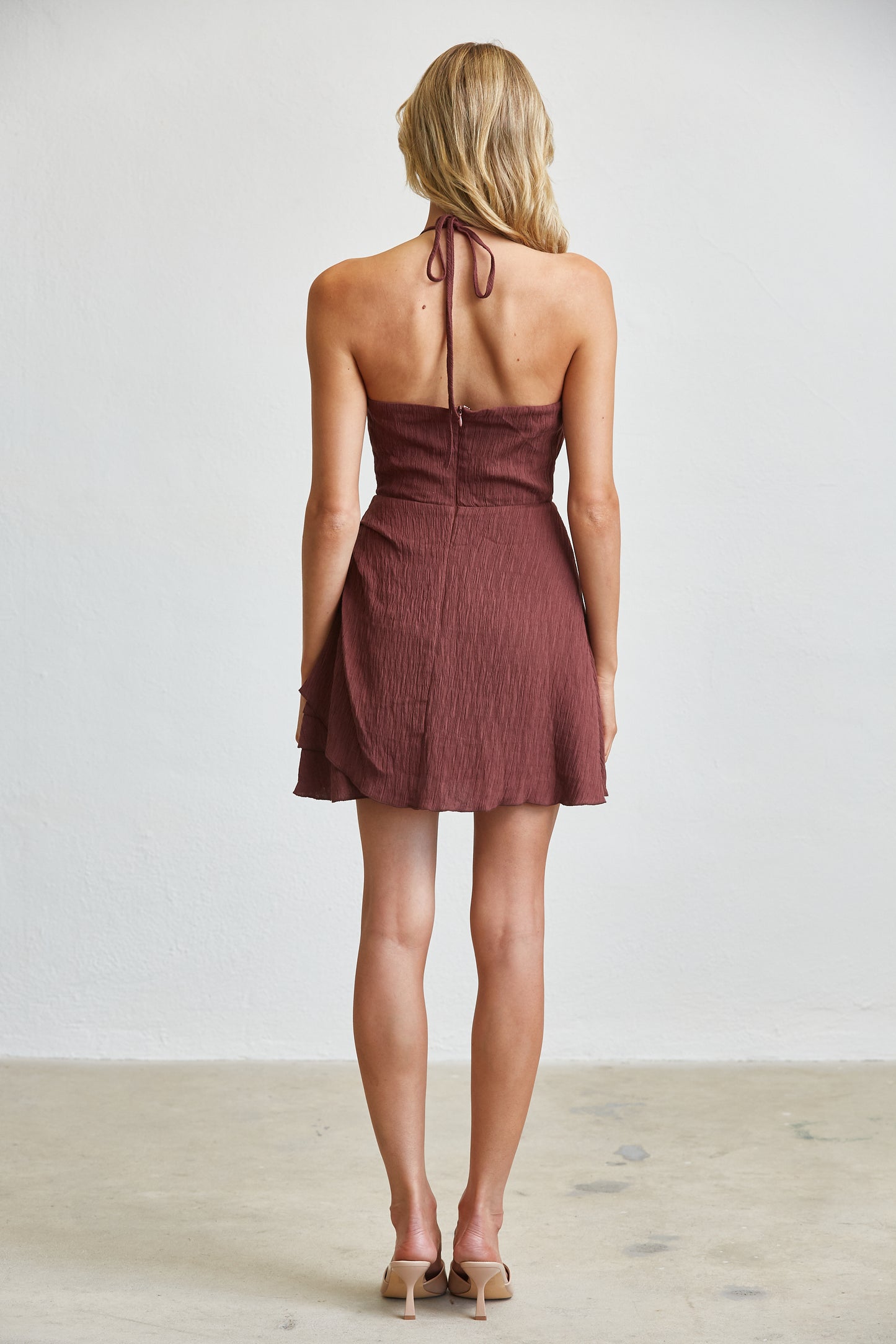TEXTURED HALTER MINI DRESS WITH RUFFLE DETAIL