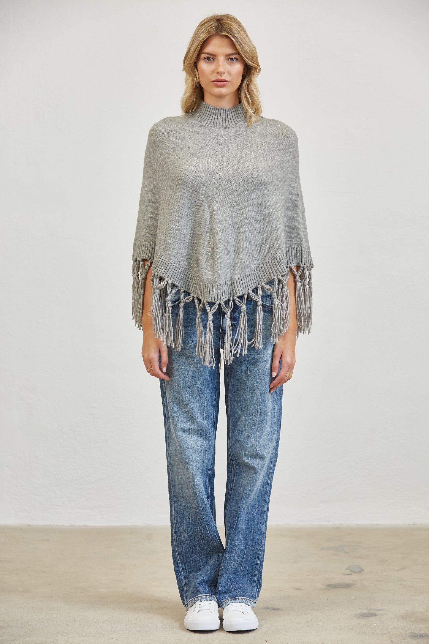 FRINGE MOCK NECK KNIT PANCHO SWEATER