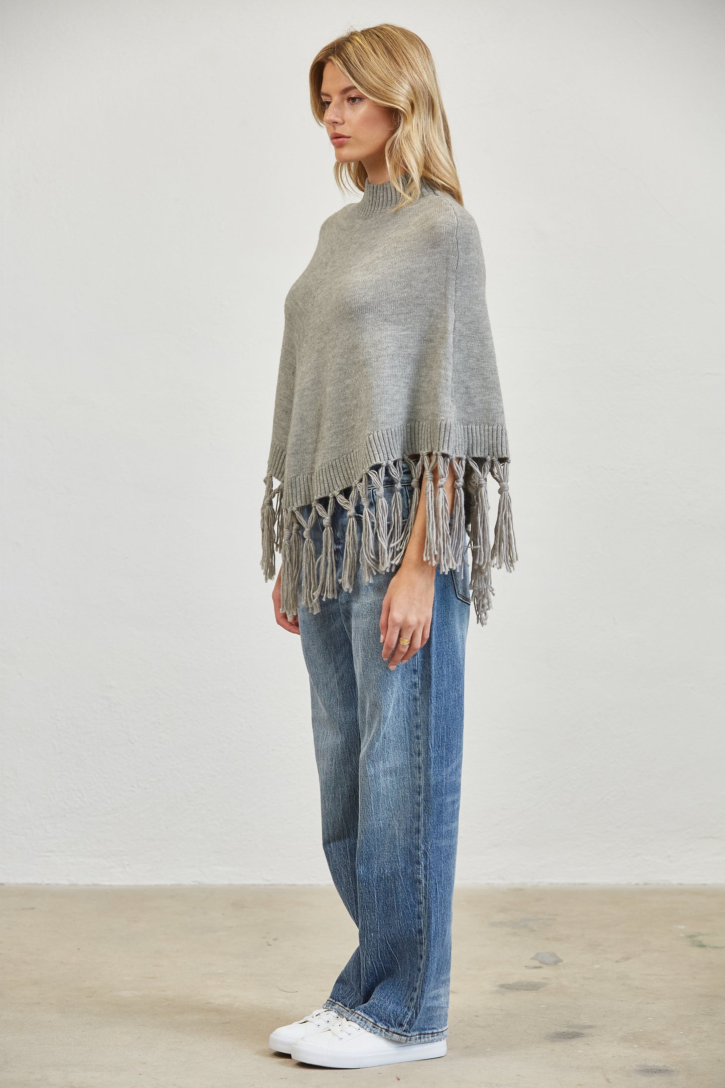 FRINGE MOCK NECK KNIT PANCHO SWEATER
