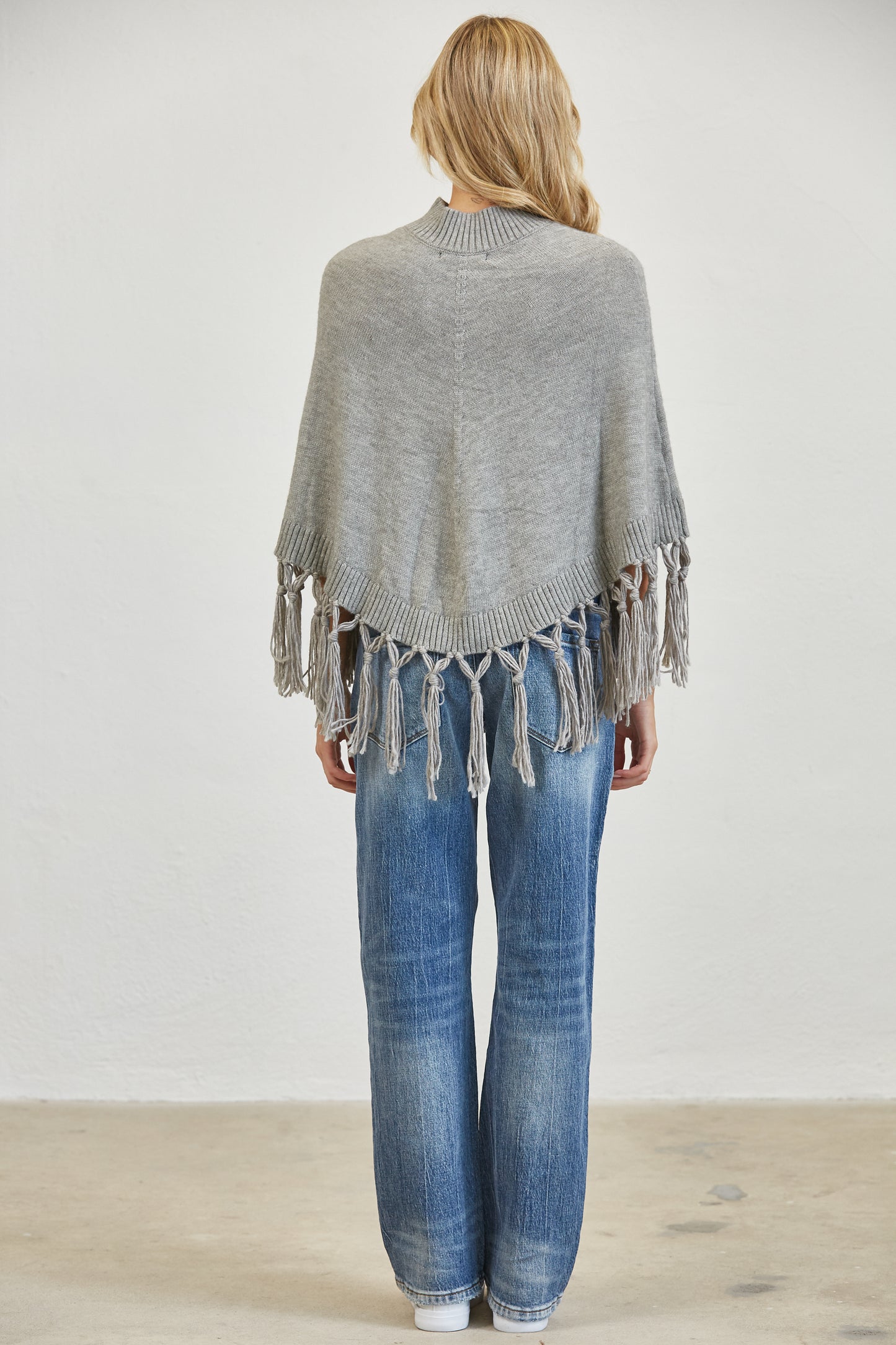 FRINGE MOCK NECK KNIT PANCHO SWEATER