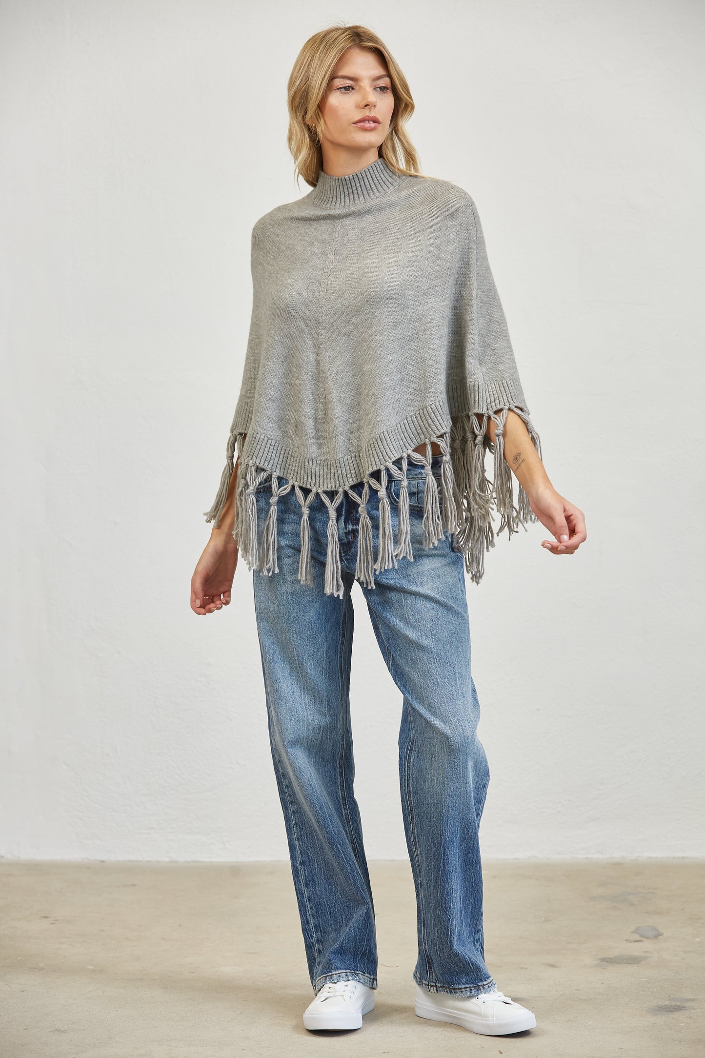 FRINGE MOCK NECK KNIT PANCHO SWEATER