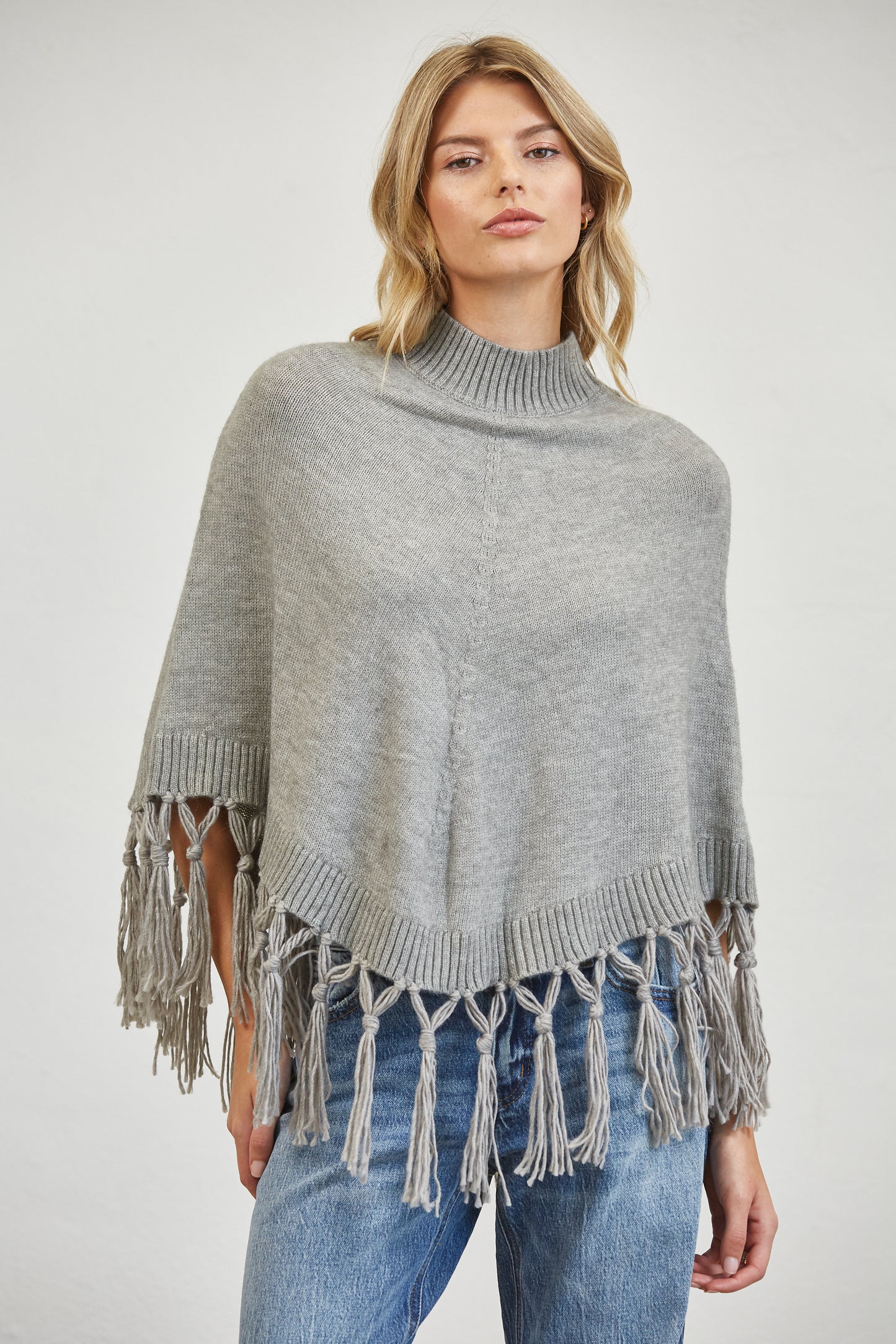 FRINGE MOCK NECK KNIT PANCHO SWEATER
