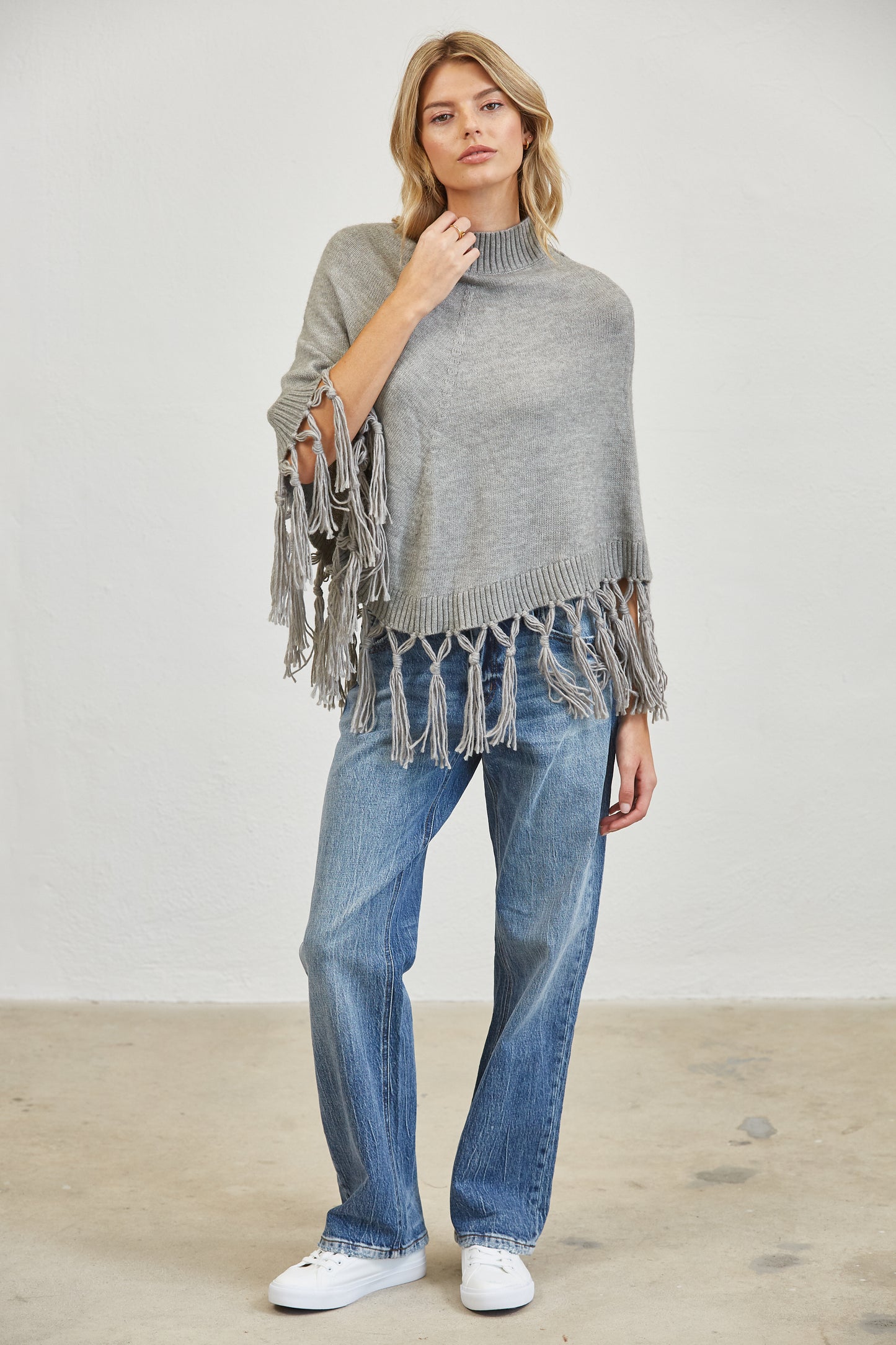 FRINGE MOCK NECK KNIT PANCHO SWEATER
