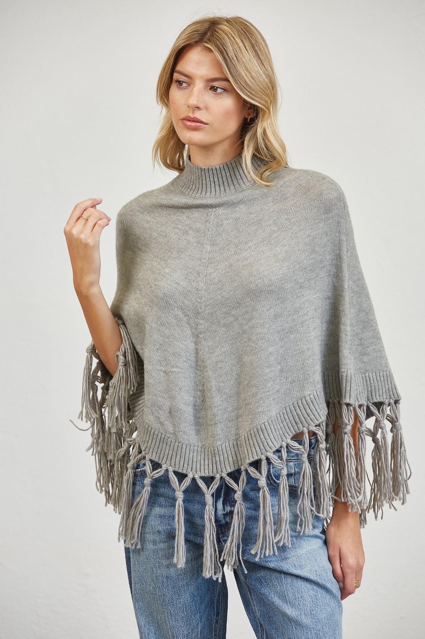 FRINGE MOCK NECK KNIT PANCHO SWEATER