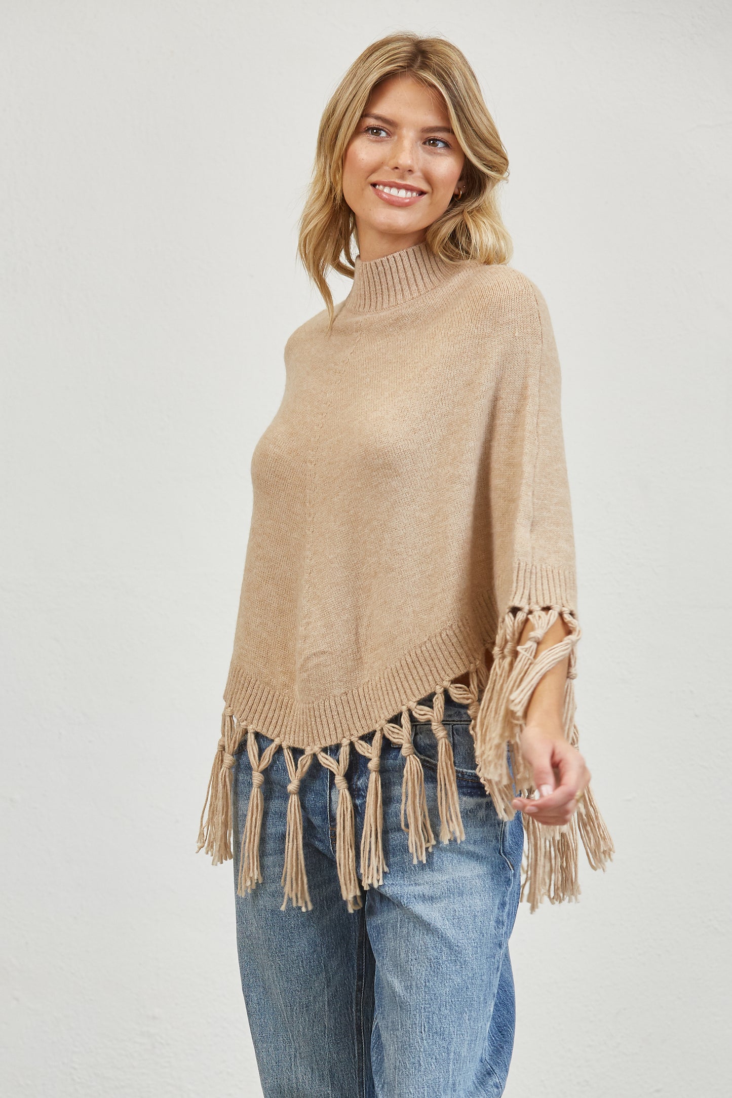 FRINGE MOCK NECK KNIT PANCHO SWEATER
